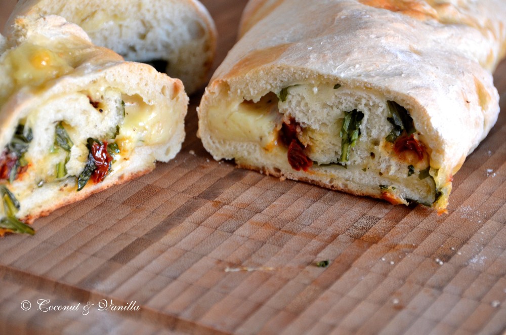 focaccia filled with cheese, arugula and dried tomatoes