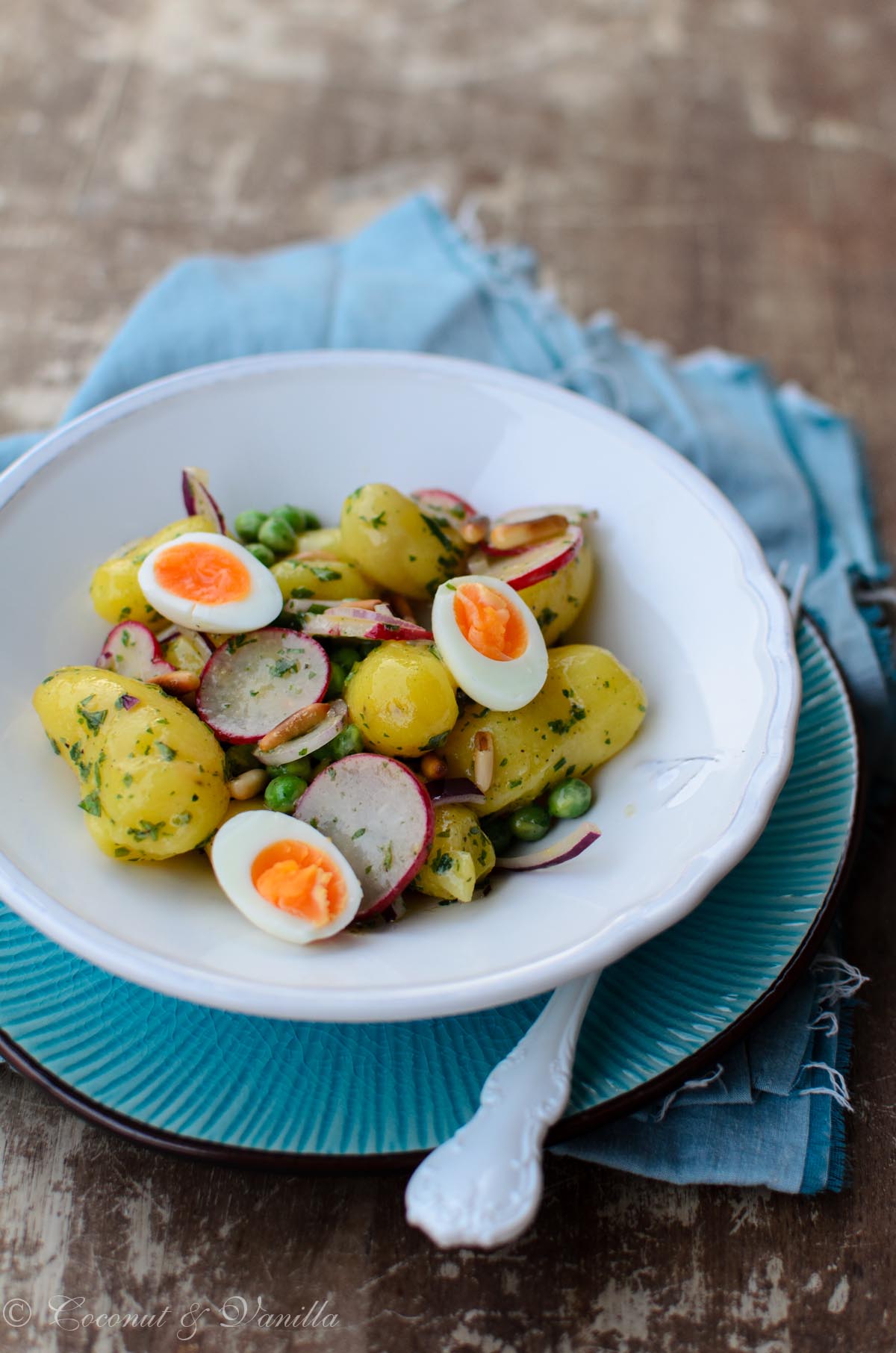 Fingerling potato salad with peas, radishes and quail eggs