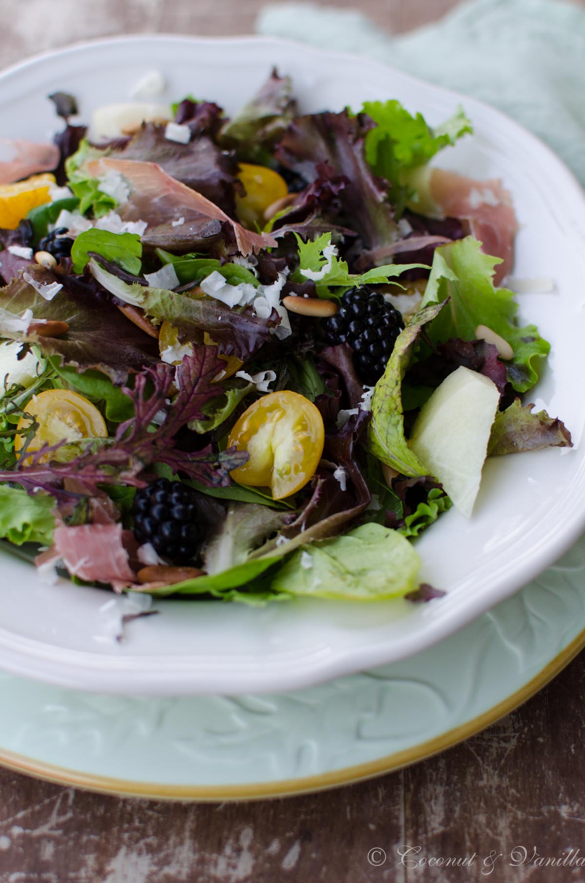 Mesclun salad with blackberries, cantaloupe and prosciutto